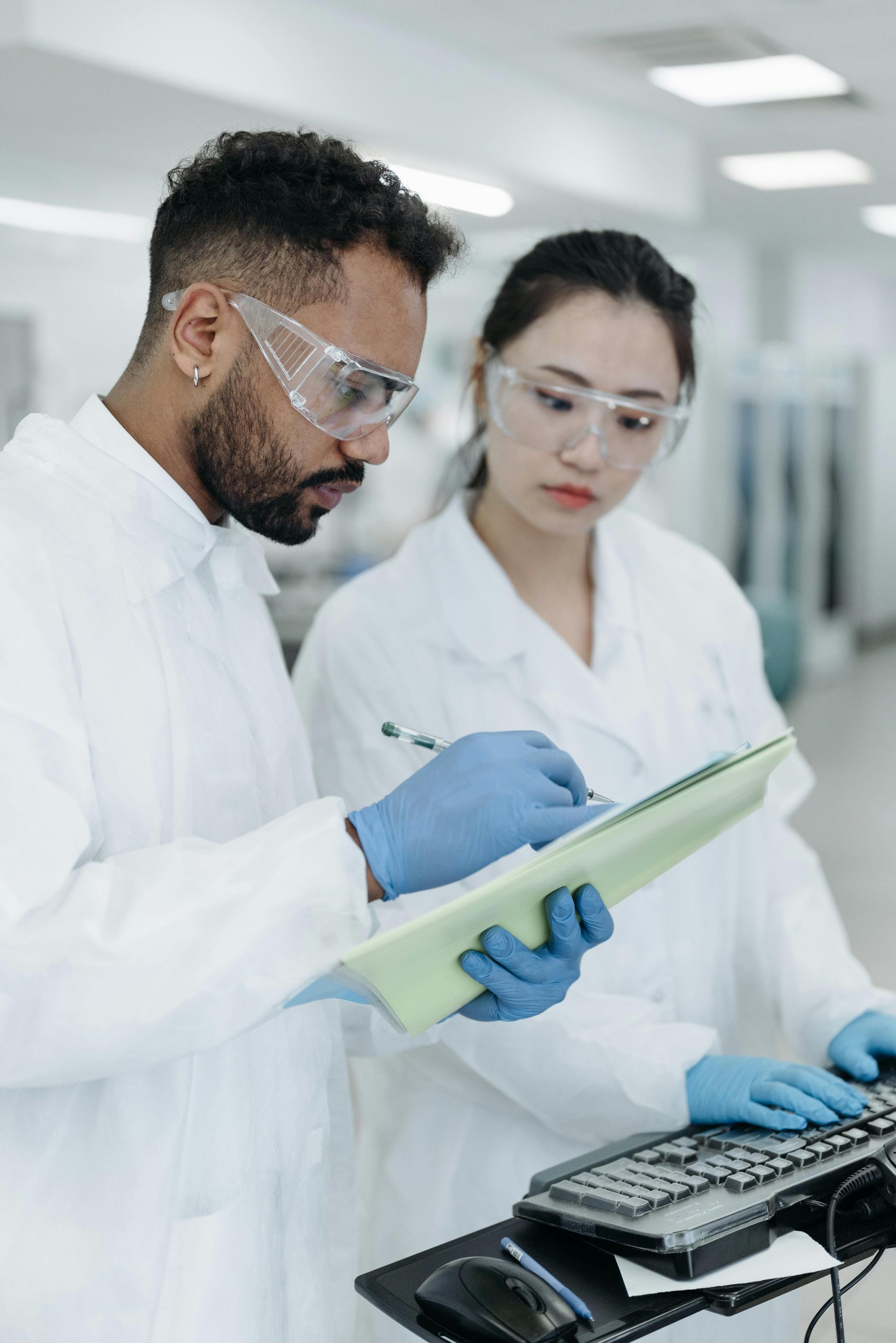 Clinical professionals reviewing documentation in a laboratory